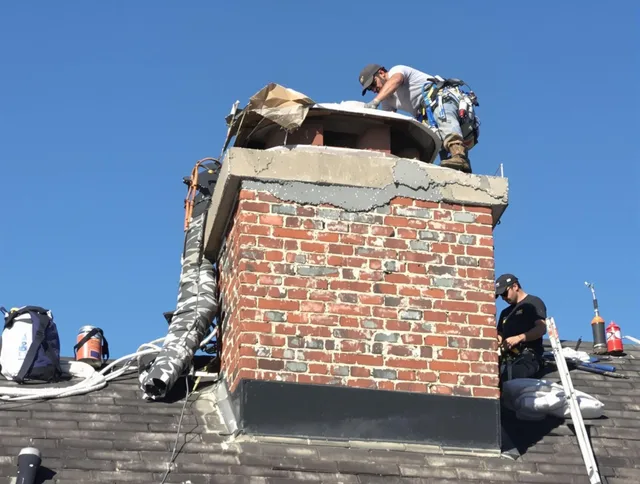 Reynoldsburg Chimney Sweep installing a custom chimney crown in Reynoldsburg, OH