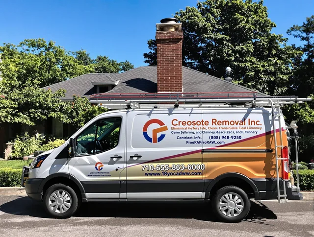 Reynoldsburg Chimney Sweep technician removing creosote safely in Reynoldsburg, OH