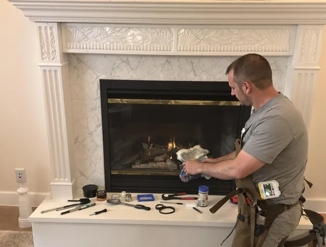 Reynoldsburg Chimney Sweep performing fireplace maintenance in Reynoldsburg, OH